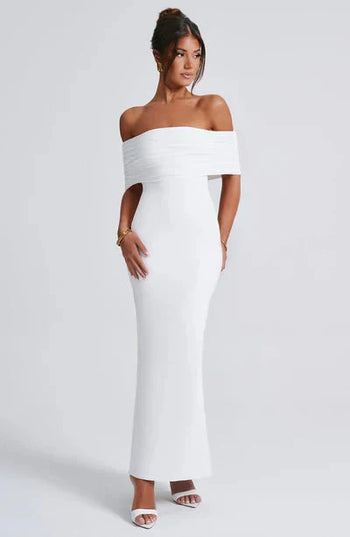 Front view of a white off-shoulder maxi dress, showing the elegant ruched bodice and sleek, tailored fit.