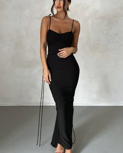 Front view of a women's black pleated plunge neck maxi dress with ruched bust and spaghetti straps