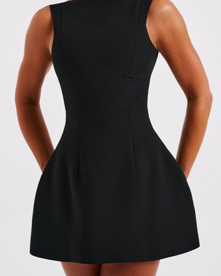 Close-up front view of a black sleeveless boat neck bubble mini dress, emphasizing the fabric texture.