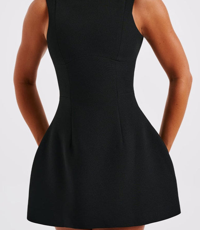 Close-up front view of a black sleeveless boat neck bubble mini dress, emphasizing the fabric texture.