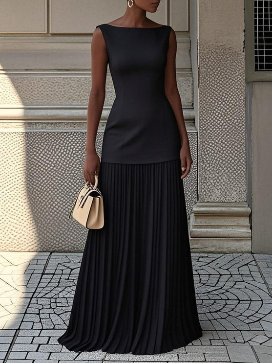 Stylish black sleeveless boat neck maxi dress with a flowing pleated skirt, for formal wear.