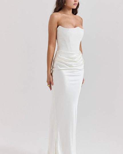 Full body view of a white off-shoulder bustier draped maxi dress with a sweetheart neckline and ruched detailing.