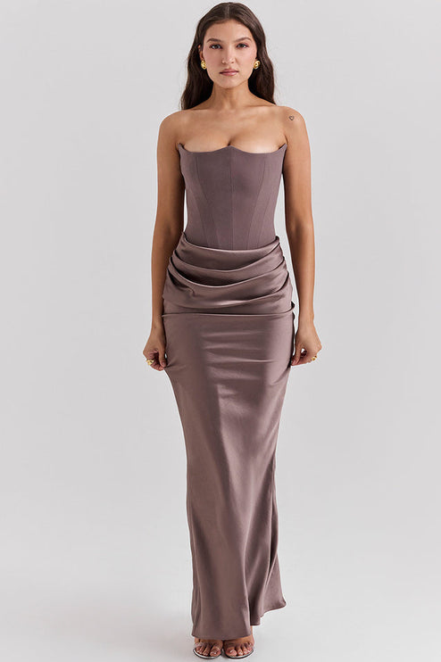 Elegant taupe off-shoulder bustier maxi dress for women, showcasing the draped waist and flowing skirt.