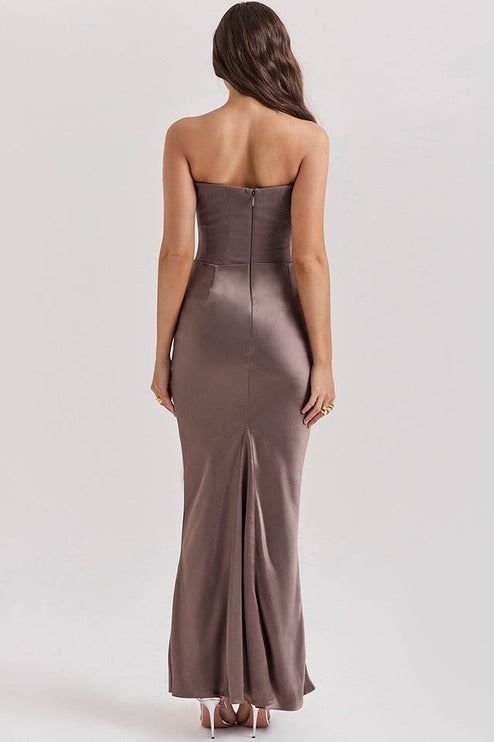 Back view of the taupe off-shoulder bustier maxi dress, showing the hidden zipper closure and floor-length design.