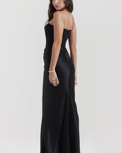 Back view of the black off-shoulder bustier maxi dress, showcasing the smooth satin fabric and floor-length design.