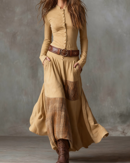 Women's long sleeve button down maxi dress in tan, featuring a plaid panel skirt and brown belt.