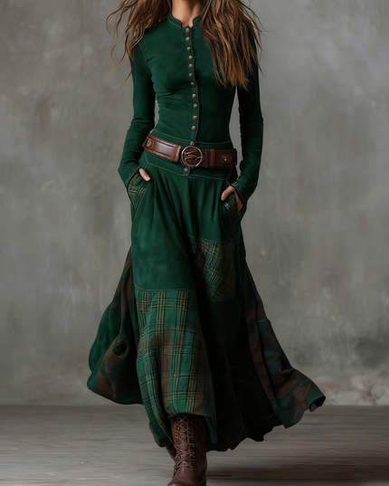 Women's long sleeve button down maxi dress in deep green, with a plaid panel skirt and brown belt detail.