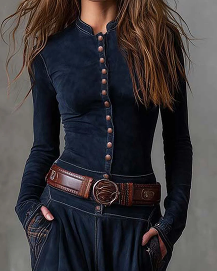 Close-up of the dark blue long sleeve button down dress with a brown leather belt and plaid pocket detail.