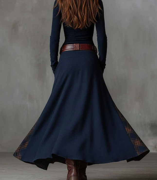 Back view of the women's dark blue long sleeve maxi dress, showing the flowing skirt and plaid trim.