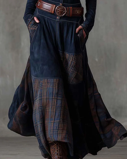 Side view of the dark blue long sleeve plaid maxi dress, highlighting the flowing skirt and earthy plaid pattern.
