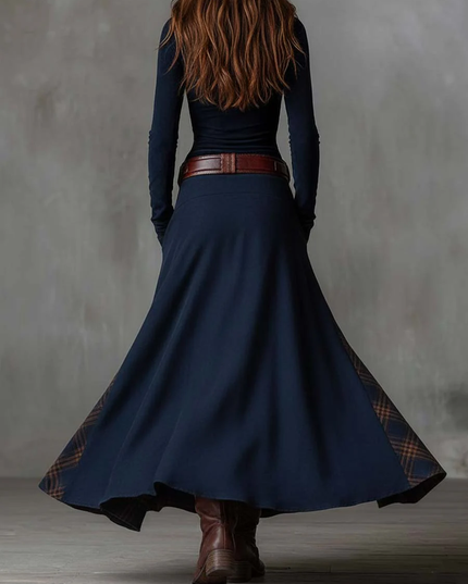 Back view of the women's dark blue long sleeve maxi dress, showing the flowing skirt and plaid trim.