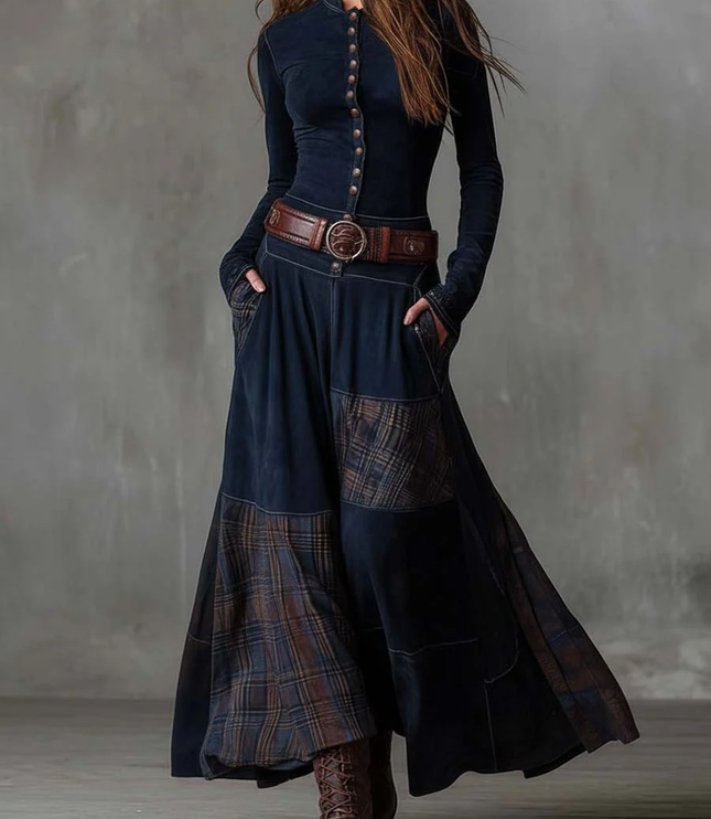 Full view of the women's dark blue long sleeve button down plaid maxi dress, styled with a brown belt.