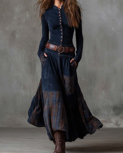Women's long sleeve button down maxi dress in dark blue, featuring a plaid panel skirt and brown belt.