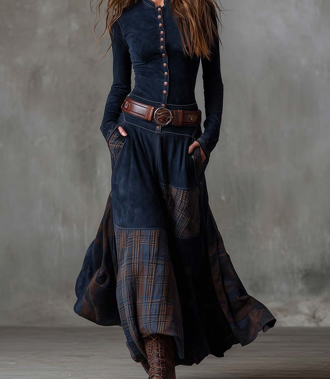 Women's long sleeve button down maxi dress in dark blue, featuring a plaid panel skirt and brown belt.
