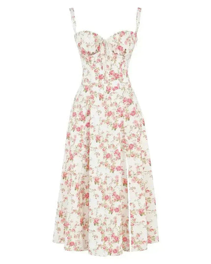 Flat lay of a white floral corset bow front midi dress adorned with vibrant pink rose patterns.