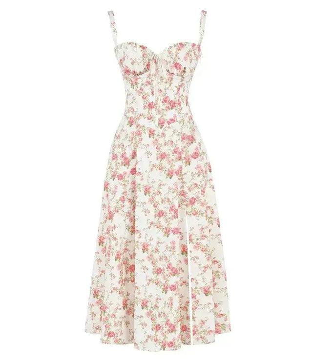 Flat lay of a white floral corset bow front midi dress adorned with vibrant pink rose patterns.