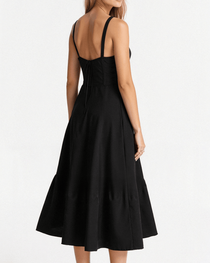 Back view of the black corset midi dress, highlighting the adjustable straps and elegant drape.