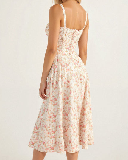 Back view of the white floral corset midi dress with pink blooms, showcasing the delicate pattern.