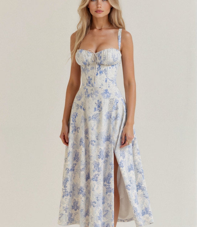 Front view of a white and light blue floral corset bow front midi dress with a side slit.