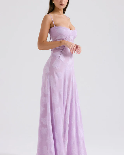Side profile of women's lavender floral corset maxi dress, showing the elegant silhouette and thin straps.