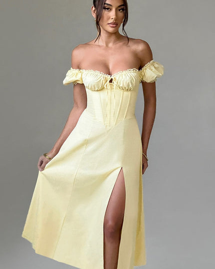 Women's light yellow off-shoulder puff sleeve corset midi dress, featuring a ruched bust and front split detail.