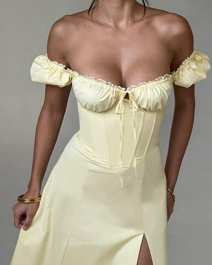 Close-up of the light yellow off-shoulder puff sleeve corset midi dress, highlighting the bust and bodice structure.