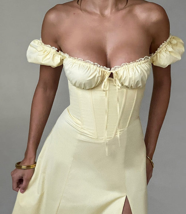 Close-up of the light yellow off-shoulder puff sleeve corset midi dress, highlighting the bust and bodice structure.