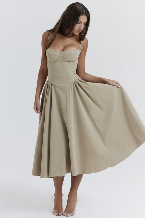 Side view of a women's light khaki sweetheart neck corset midi dress, showing the flowing skirt and structured bodice.
