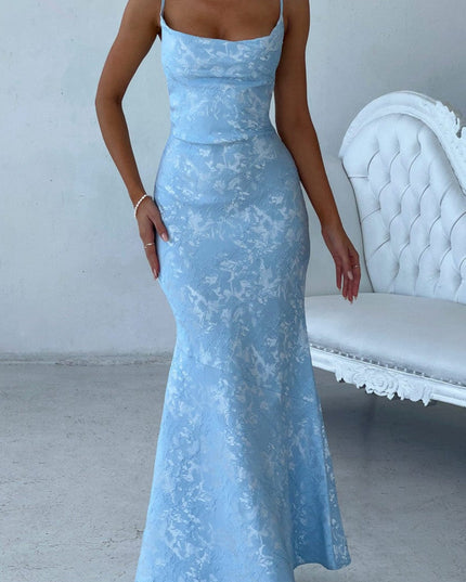 Front view of women's light blue floral maxi dress with tied shoulder straps and a fitted bodice, ideal for prom or formal events.