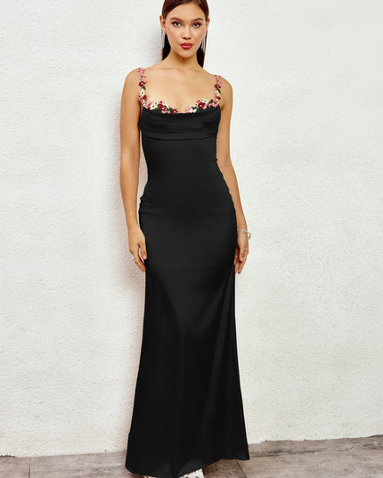 Front view of a black formal floral cowl neck open back maxi dress, showcasing the elegant silhouette.