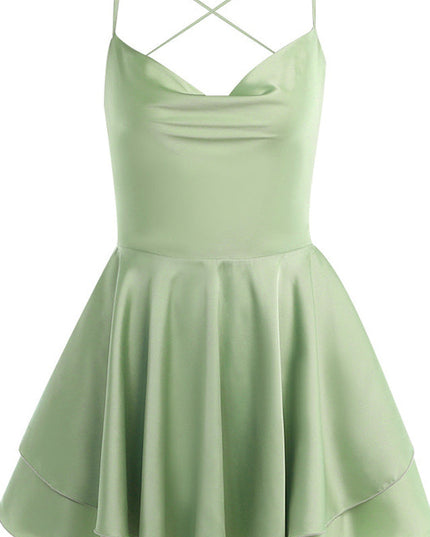 Light green satin cowl neck mini romper with spaghetti straps and a tiered ruffled skirt.