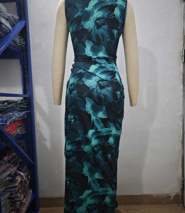 Side profile of a women's form-fitting midi dress featuring a teal and black gradient floral design.