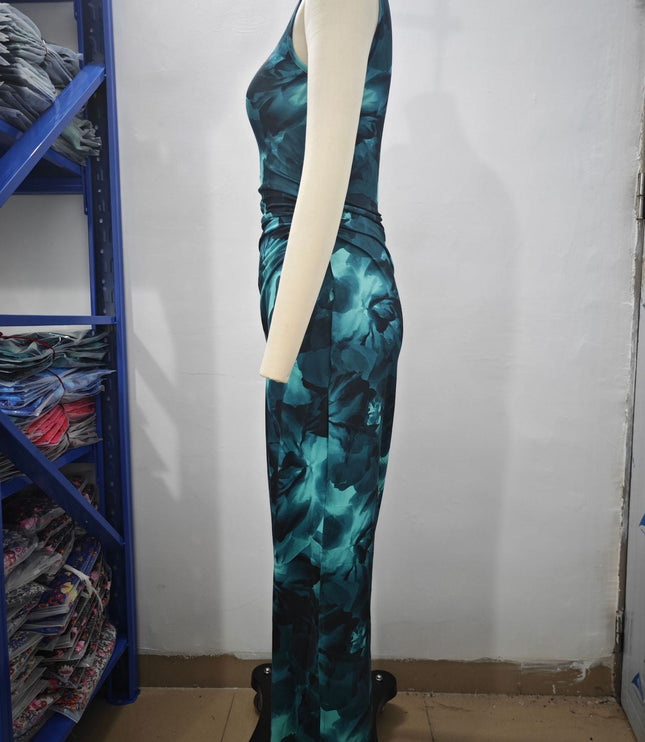 Front view of a woman wearing a brown and black gradient print crew neck midi dress with a ruched bodice.