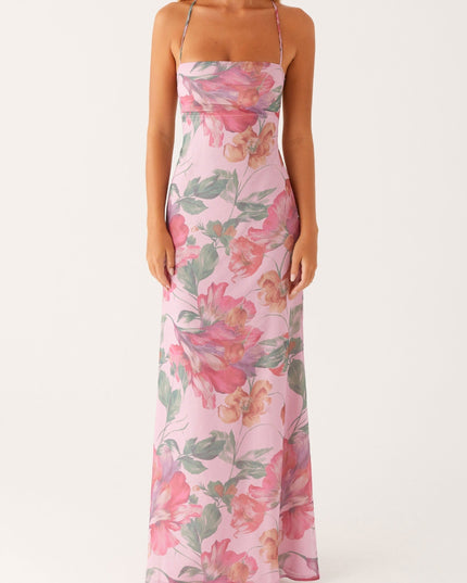 Full front view of a women's pink floral square neck maxi dress, highlighting the vibrant pattern.