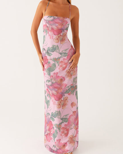 Front view of a women's pink floral square neck maxi dress with thin straps and a flowing skirt.