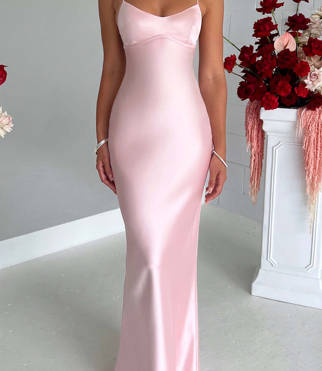 Front view of a light pink satin maxi dress with spaghetti straps and a sweetheart neckline, for wedding suits for women.