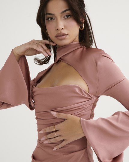 Close-up of the dusty rose halter cut out mini dress, showing the intricate ruching and high neck detail.