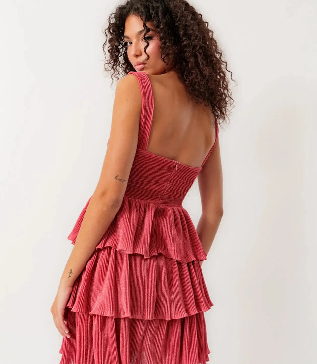 Back view of the women's coral summer mini dress showcasing the tiered ruffles and fitted bodice.