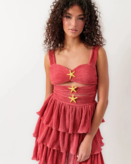 Women's summer cut out mini dress in shimmery coral with tiered ruffles and gold starfish details.