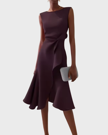 Sleeveless draped asymmetric midi dress in a rich burgundy shade, with a subtle side ruffle detail. for a woman's suit dress alternative.
