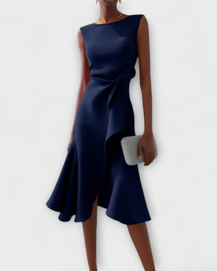 Elegant navy blue sleeveless midi dress with a unique draped asymmetric design and a subtle side ruffle, ideal for women's formal wear.