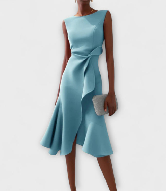Light blue sleeveless midi dress with a sophisticated draped asymmetric cut, featuring a ruffled accent at the waist and a flowing skirt.