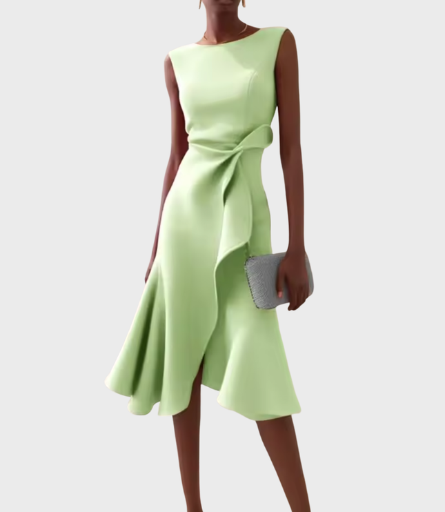 Soft mint green sleeveless midi dress with a contemporary draped asymmetric cut, showcasing a delicate side ruffle and a flowing hem.