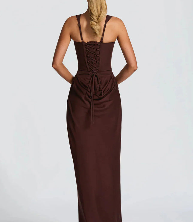 Back view of a women's black square neck draped corset maxi dress, featuring a lace-up back detail.