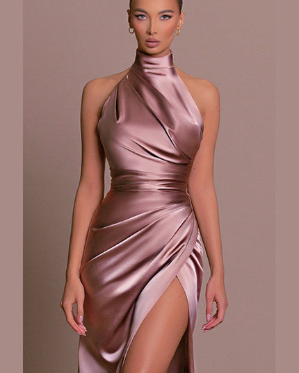 Close-up of the rose gold formal maxi dress, highlighting the draped halter neck and ruched waist detail.