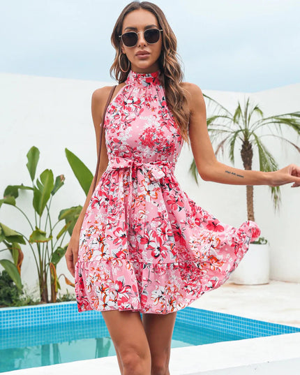 Pink floral halter neck tiered mini dress with a high neckline and a silhouette.