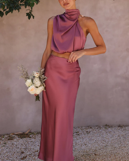 Front view of a women's plum satin two-piece maxi set, featuring a draped high neck crop top and long skirt.