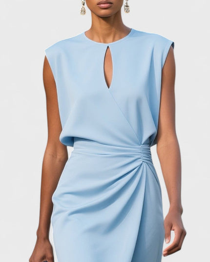Close-up of light blue round neck keyhole midi dress with intricate draped waist detail, showcasing the fabric and tailoring.