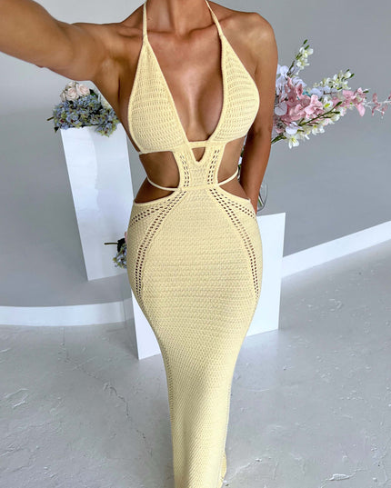 Full-length view of a women's yellow crochet knit plunge halter cut out maxi dress, featuring intricate side cut-outs and a flowing skirt.