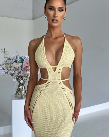 Close-up front view of the light yellow crochet knit maxi dress, focusing on the plunge neckline and geometric cut-outs.